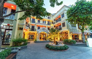A hotel with a central courtyard, multiple balconies, and a sign indicating it is Hotel Clyclyp 3. - Annam Heritage Boutique Hotel & Spa (Da Nang)