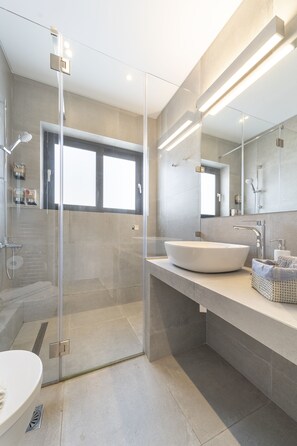 Shower, hair dryer, towels, soap