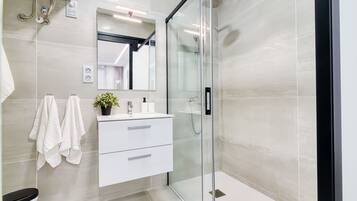 Shower, hair dryer, towels, soap