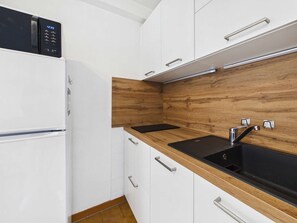 Fridge, microwave, stovetop, coffee/tea maker