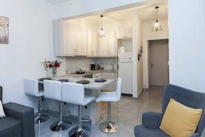 Apartment | Private kitchen | Full-size fridge, oven, toaster, cookware/dishes/utensils