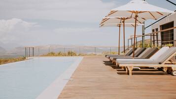 Outdoor pool, pool umbrellas, pool loungers