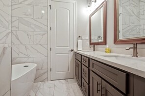 Shower, hair dryer, towels, shampoo
