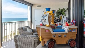 A toy ship on a balcony with a view of the ocean. - Oceanfront 3BR w/ Incredible Views+Balcony+Pools (Orange Beach)