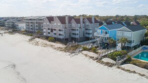 A beachfront hotel with multiple-story buildings, balconies, and a swimming pool. - Oceanfront 3 BR Condo with a Shared Pool! Surfside By The Sea II 202 (Surfside Beach)