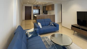 Luxury Apartment, City View | Living area | Smart TV
