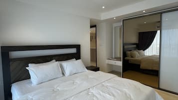 Luxury Apartment, City View | Iron/ironing board, bed sheets