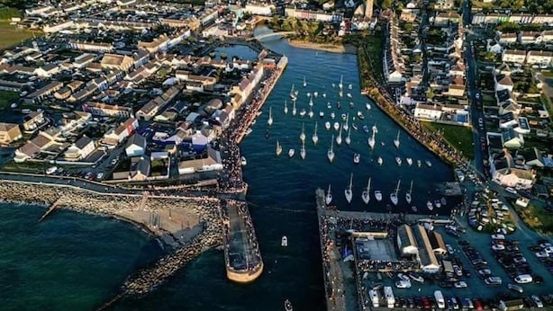 An aerial view of a coastal town with a marina, boats, and a mix of residential and commercial buildings. - Luxury Pods - Sleeps 2 & Free Parking (Aberaeron)