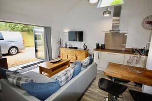 Luxury House | Living area | 40-inch LED TV with digital channels, DVD player, foosball - Pamper House Holiday Home And Annex (Ferndown)