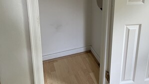 A room with a wooden floor, white walls, and a white door. - The Modern beach bungalow. 7 minutes to ocean front, full private home!  (Virginia Beach)