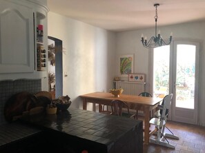Enjoy meals together at the large table in this family-friendly kitchen with a view of the outdoors.