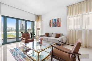 Design Apartment | Living area | 50-inch Smart TV with cable channels - WelHome - Reem Diamond Residence (Abu Dhabi)