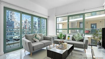 Standard Apartment | Living area | 50-inch Smart TV with cable channels