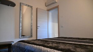 1 غرفة نوم ومكواة/لوح كي وواي فاي وملاءات أسرّة