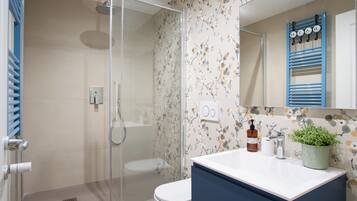 Shower, hair dryer, towels, soap