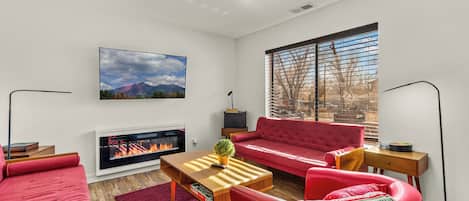 Smart TV, fireplace, books, music library