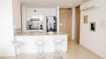 Apartment (CM02I) | Private kitchen | Full-size fridge, microwave, oven, stovetop