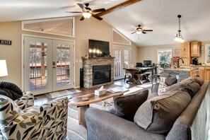 TV, fireplace - Riverfront Retreat with Deck, Fire Pit & Views (Franklin)
