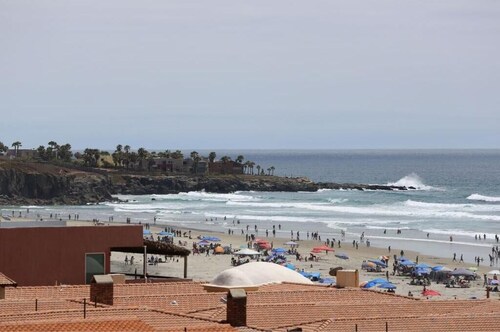 Private beach apartment with balcony and direct access to sandy beach!