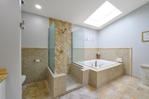 Jetted bath, hair dryer, towels, soap