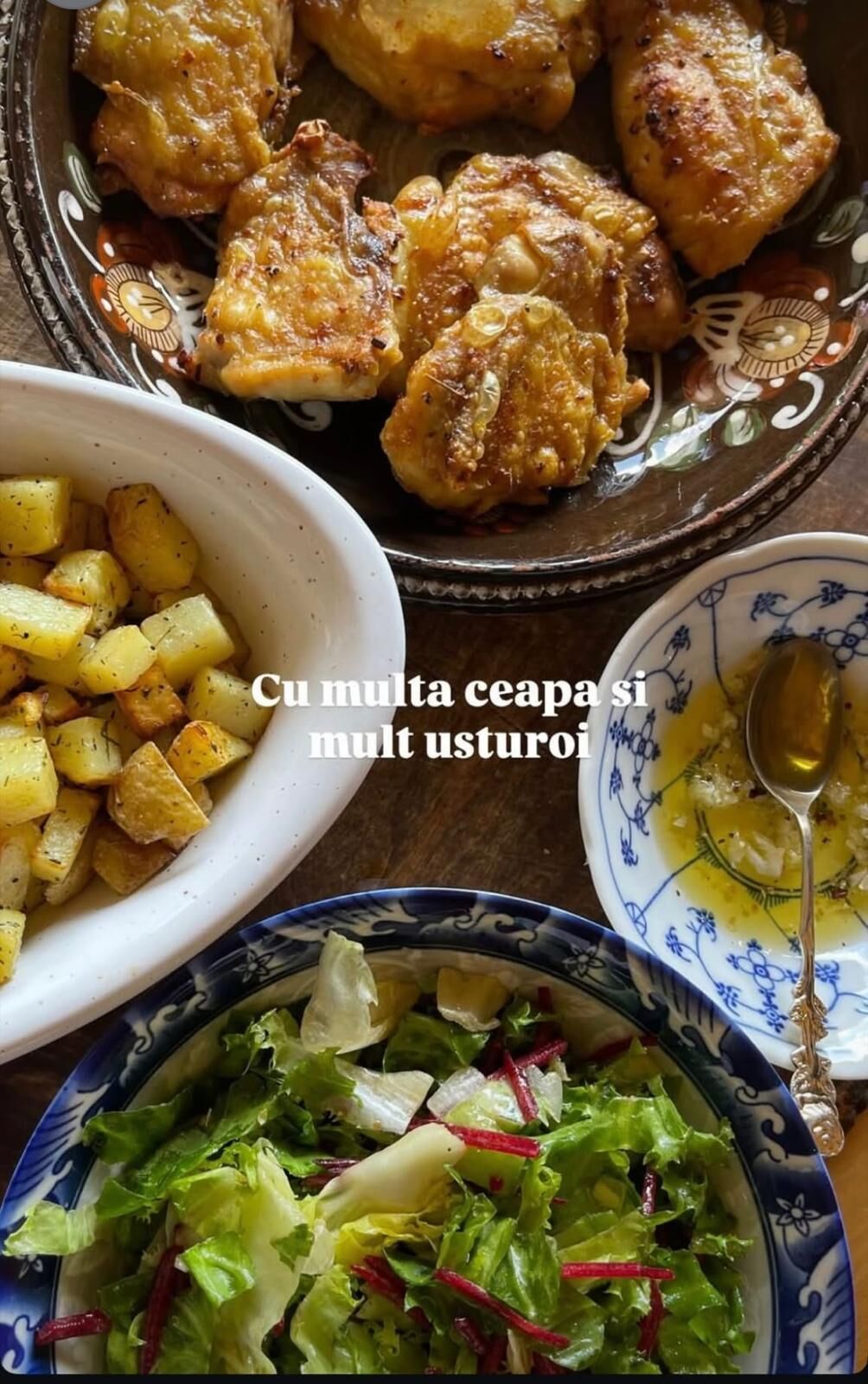 A meal consisting of roasted chicken, potatoes, and a salad.