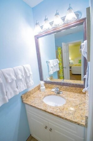 Hair dryer, towels, soap, shampoo