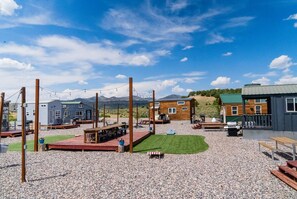 Outdoor dining - Lion Canyon was built by Mitchcraft in Fort Collins, Colorado as part of HGTV's "Tiny House Hunters". This home has two lofts, each with a Queen bed. One is accessible by stairs and one by ladder. (Meeker)