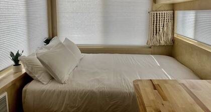 Tiny home with one queen bed.