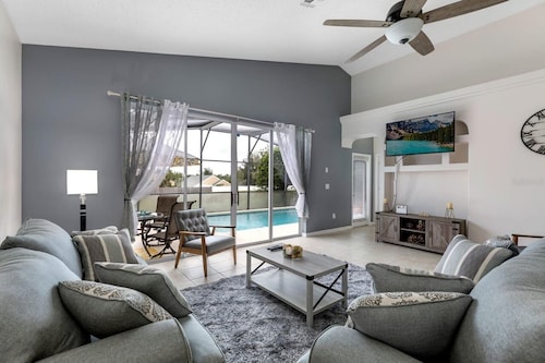 Lovely home near Disney with a Heated pool and game room in a resort community.