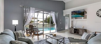 Lovely home near Disney with a Heated pool and game room in a resort community.