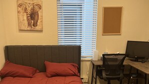 A bedroom with a bed, a desk, and a computer. - Private Quaint Cozy Room (Denver)