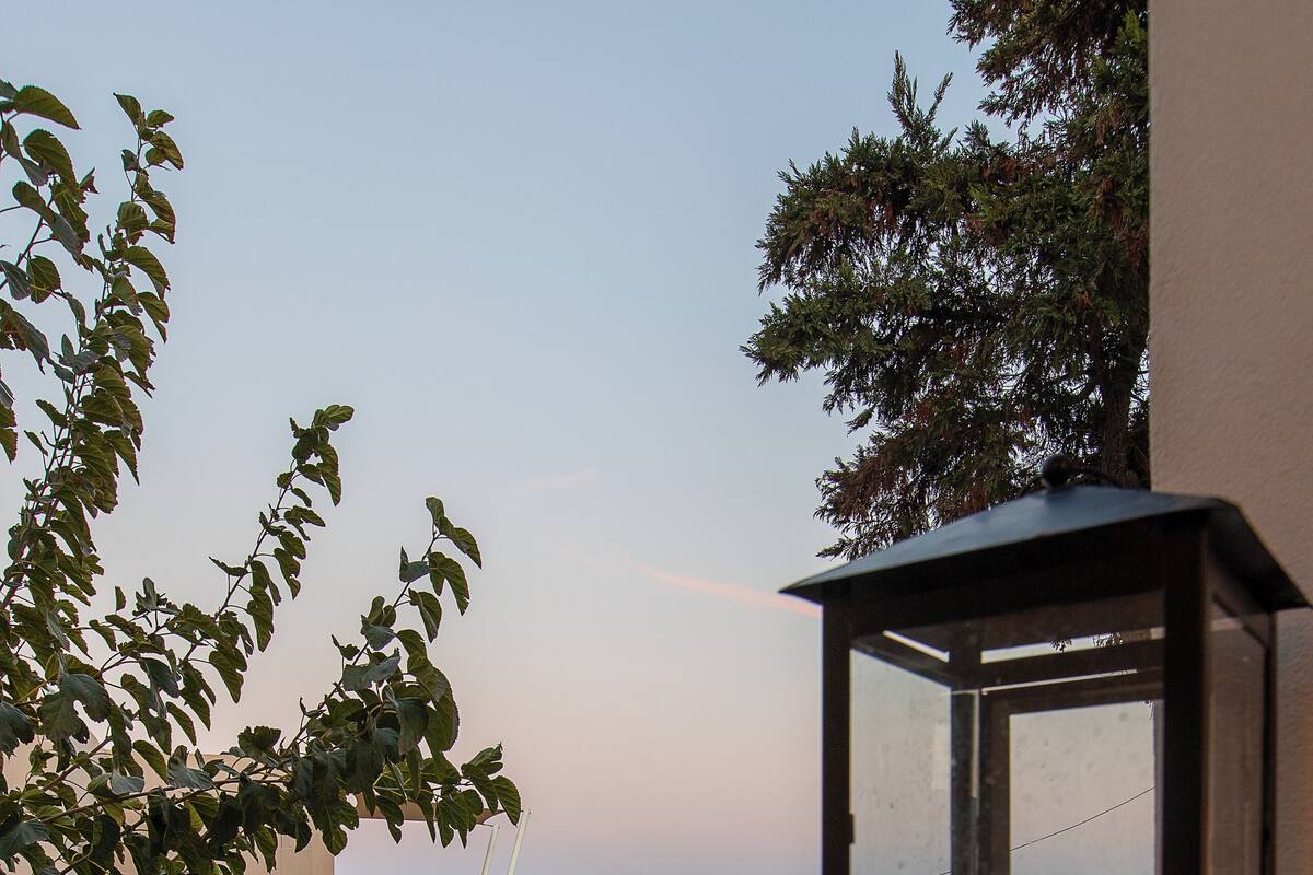 A pool area with a glass enclosure and a candle.