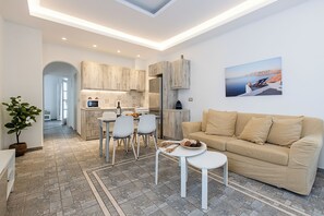 Deluxe Suite, Garden View | Living area - Santorini Villatzio Suites (Santorini)