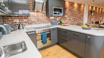 Fridge, electric kettle, toaster, cookware/dishes/utensils