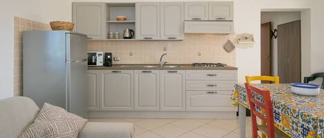 Fridge, microwave, stovetop, coffee/tea maker