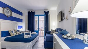 A hotel room with a bed, a sofa, a TV, and a window. - Holiday Apartment "Home Borgo Rio Favara" with Private Terrace & Wi-Fi (Ispica)