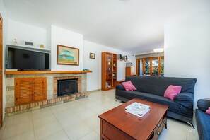 TV, fireplace - Holiday Home 'Ses Nines' with Private Terrace, Wi-Fi and Air Conditioning (Mal Pas-Bon Aire)