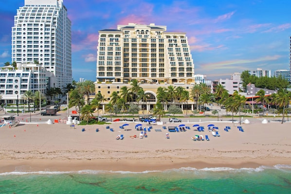 On the beach, sun-loungers, beach towels
