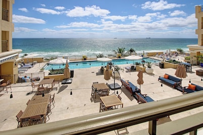 LOW PRICE but HIGH ENJOYMENT! Wake up to oceanfront views from your 2 Queen beds