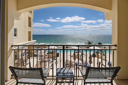 LOW PRICE but HIGH ENJOYMENT! Wake up to oceanfront views from your 2 Queen beds