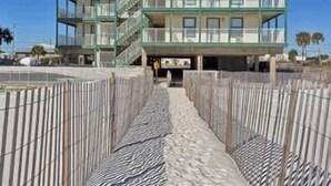 A multi-story hotel with balconies and a beach view. - Sundial 1C -- Beachfront Complex. Beautiful condo just steps to the beach! (Gulf Shores)