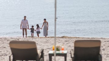 On the beach, sun loungers, beach umbrellas, 4 beach bars