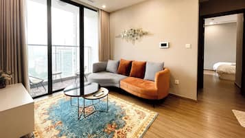 Senior Apartment, 2 Bedrooms, Balcony, City View | Living area | 50-inch Smart TV with cable channels