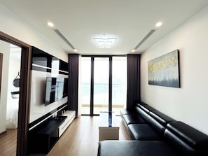 Senior Apartment, 2 Bedrooms, Balcony, City View | Living area | 50-inch Smart TV with cable channels - Vinhomes Skylake Kane Apartment (Hanoi)