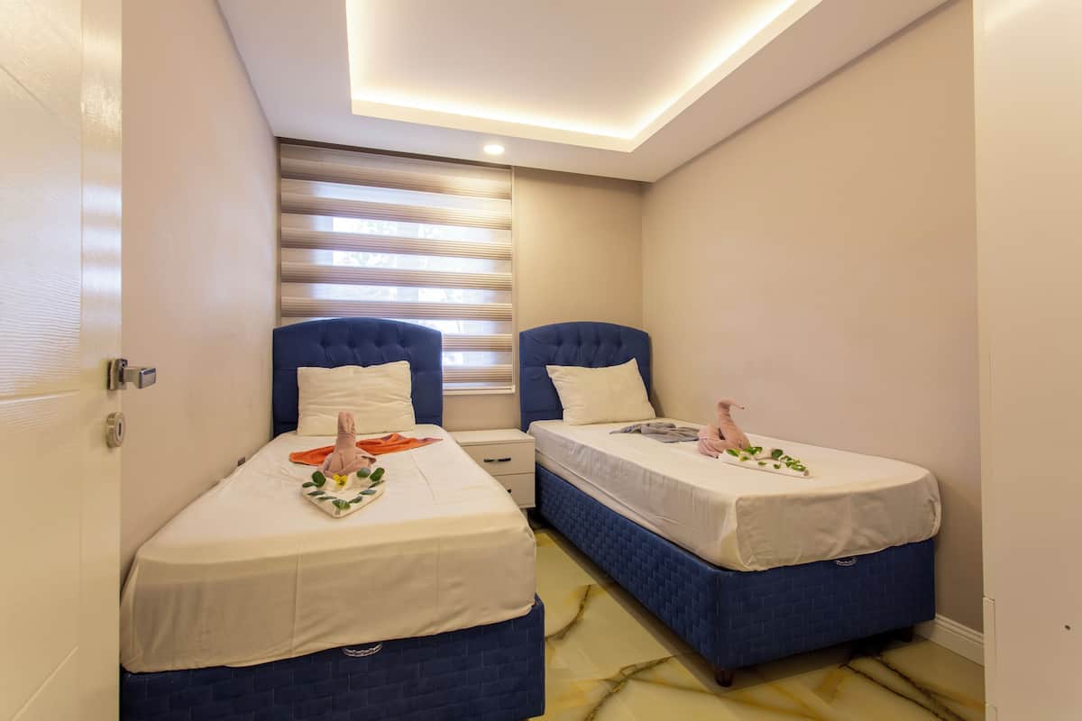 Elite Suite, 2 Bedrooms | 1 bedroom, blackout curtains, iron/ironing board, free WiFi