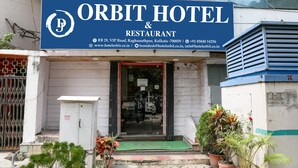 The exterior of Orbit Hotel & Restaurant with a signboard displaying the name and contact information. - Hotel Orbit Digha (Kanthi)