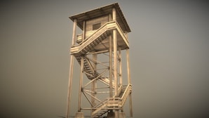 A tall wooden tower with a staircase leading to an upper platform.