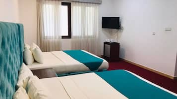 Superior Triple Room | In-room safe, individually decorated, desk, laptop workspace