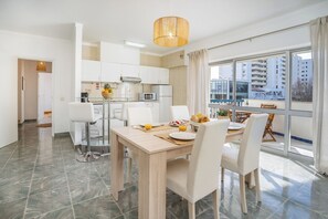 Enjoy meals in this dining area with a view of the surrounding cityscape.