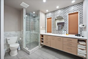 Shower, hair dryer, towels, shampoo